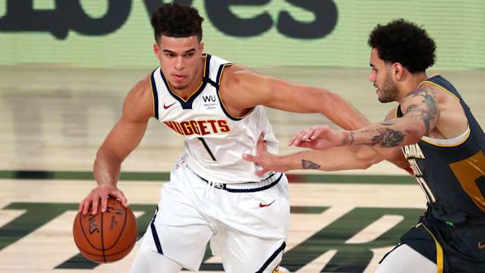 Denver Nuggets forward Michael Porter Jr. handles the ball against Oklahoma City Thunder forward Abdel Nader